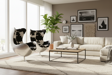 Modern Egg Chair in Full Cowhide Upholstery – Luxury Swivel Accent Chair with Stainless Steel Base