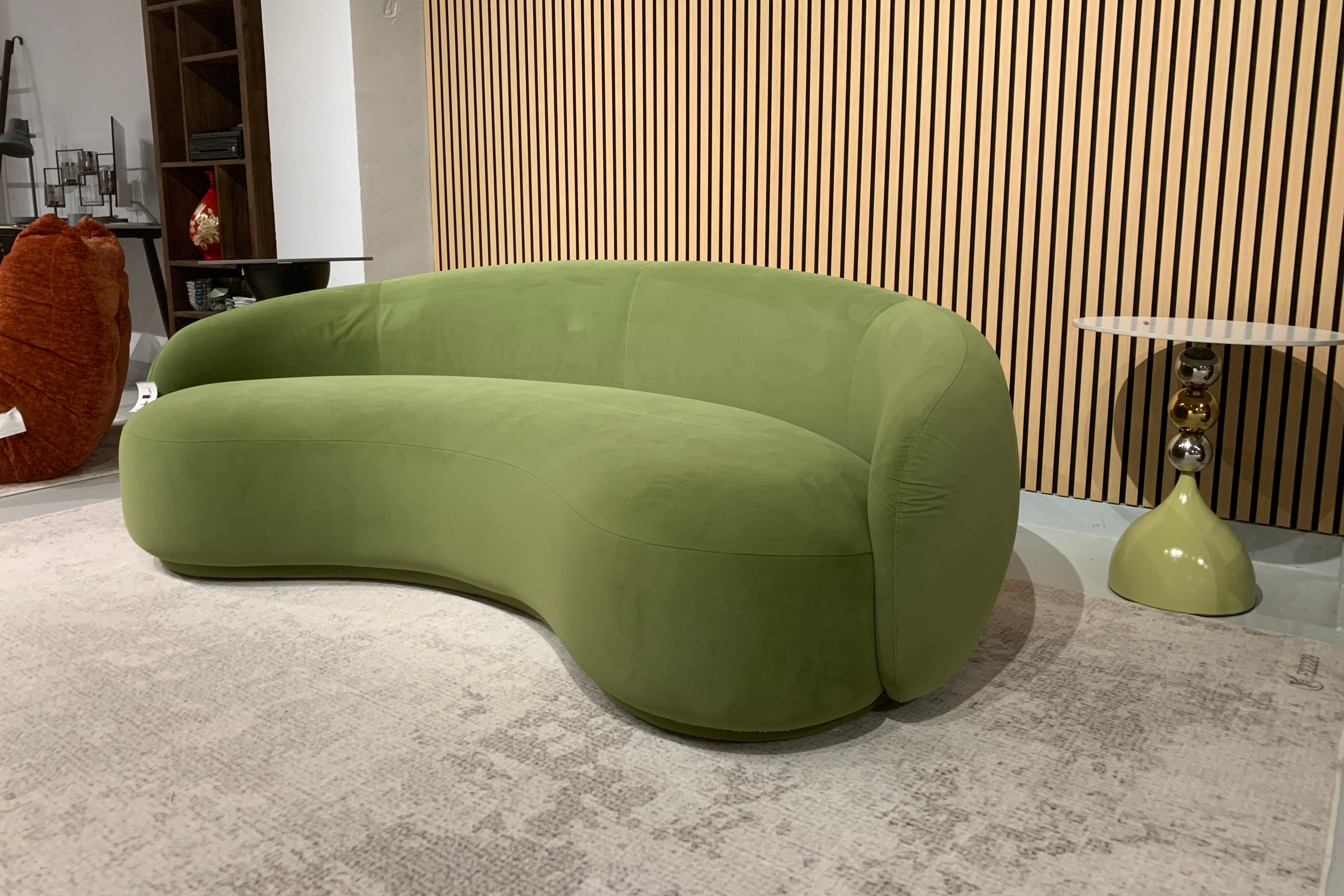 Green Velvet Curved Sofa Sculptural Upholstered Arc Couch for Contemporary Living Rooms in stock